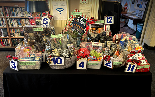 Photograph of baskets on a table. From the Holiday Basket Drawing at Wyomissing Public Library