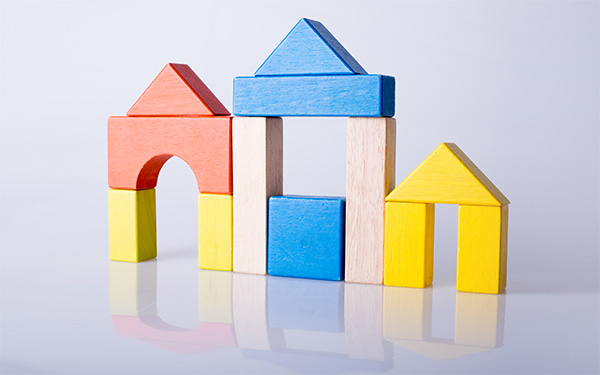 Graphic showing colored wooden building blocks